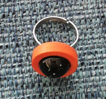 Shungite rings of orange or beige wood.